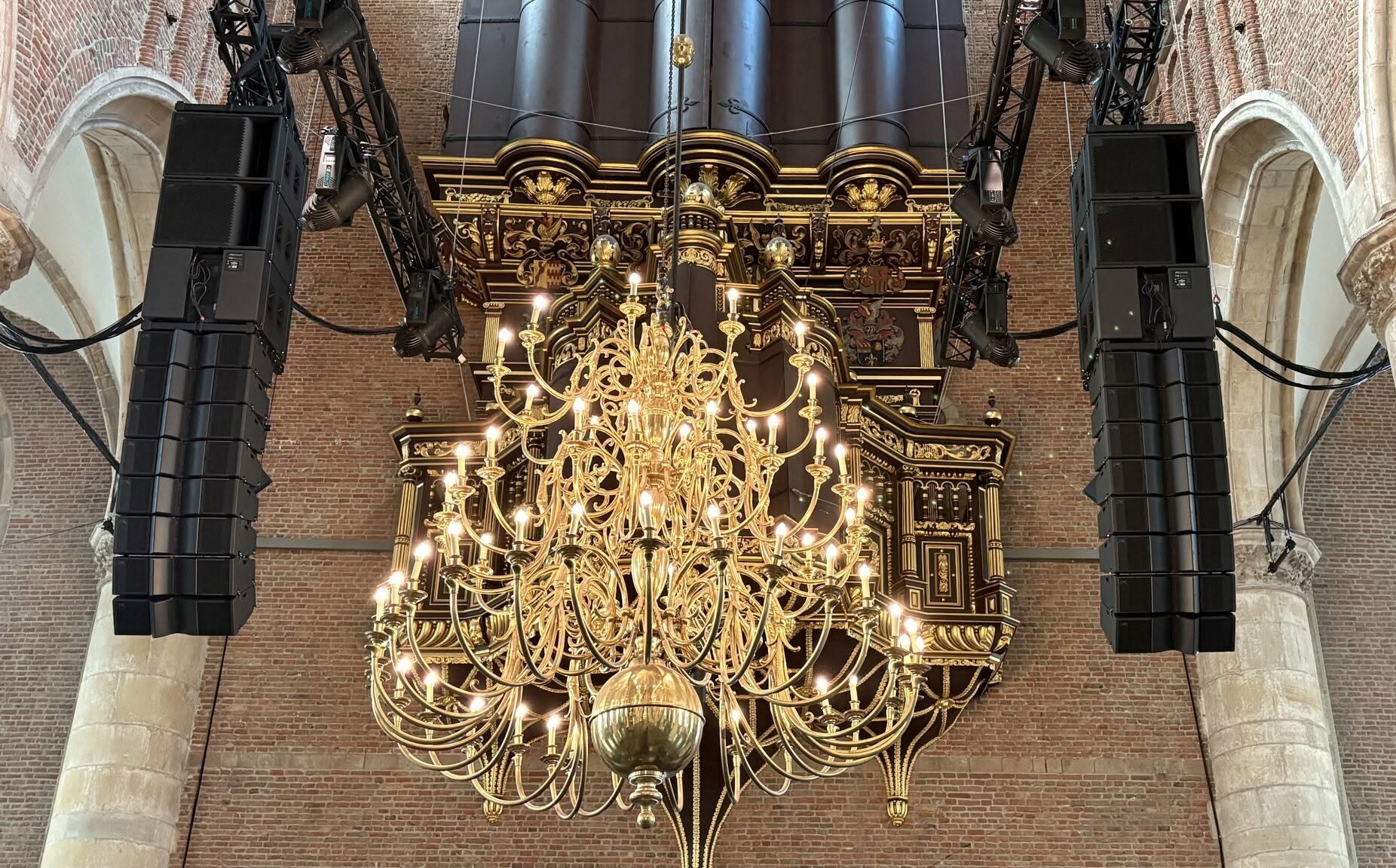 PK arrays flanking the historic pipe organ of a European concert hall